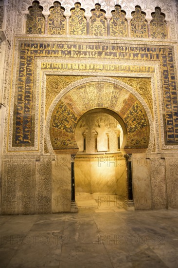 Richly inscribed stonework of keyhole shaped Mihrab, the centrepiece of the Great Mosque, Cordoba,