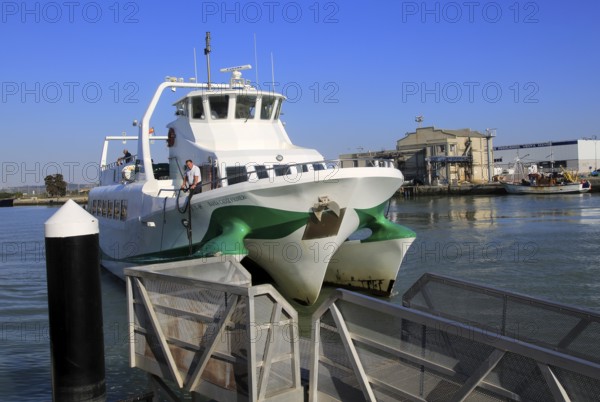 Passenger ferry boat Catamaran Bahia service arriving at Puerto de Santa de Maria, Cadiz province,