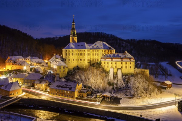 Winter evening in the Müglitz valley, impressively illuminated Weesenstein Castle at the blue hour,