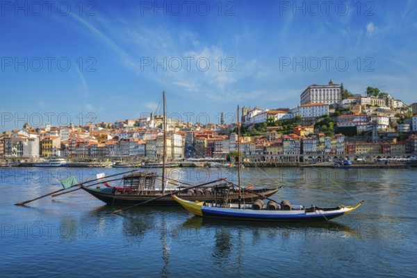 View of Porto city and Douro river with traditional boats with port wine barrels from famous