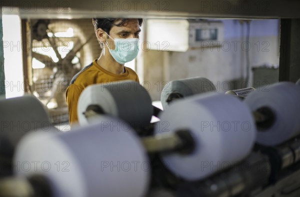 Employees of Inter Market Knit Private Limited producing socks. Lahore, 22.08.2024. Photographed on