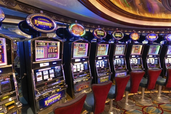 Seattle, USA, 18 September 2022: Casino gambling blackjack and slot machines waiting for gamblers