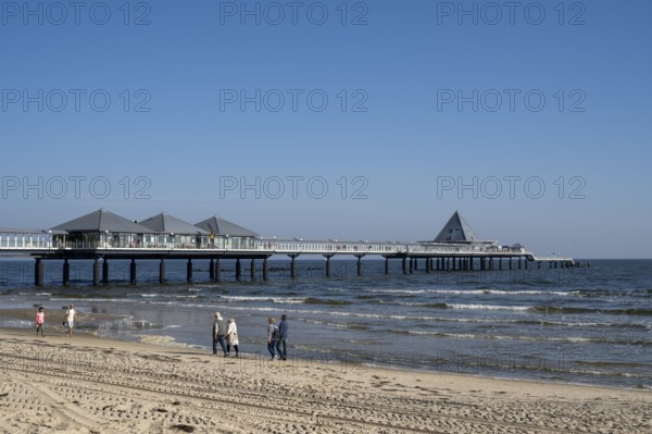 Holidaymakers walking on the beach, pier, Heringsdorf, Usedom Island, Baltic Sea,