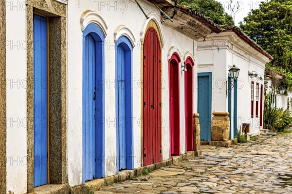 Facade of old houses in colonial architecture with their colorful doors, Paraty, Rio de Janeiro,