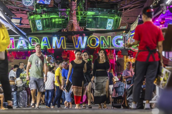 Crowds of people on Bangla Street in the evening. Nightlife on Bangla Walking Street with go-go