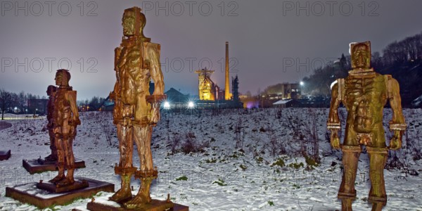People made of iron, multi-part iron sculpture by Zbigniew Fraczkiewicz in front of the
