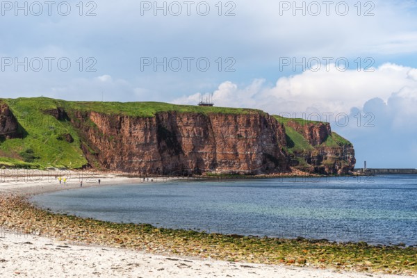 View over the Nordstrand, red sandstone cliff on the offshore island of Heligoland, North Sea,