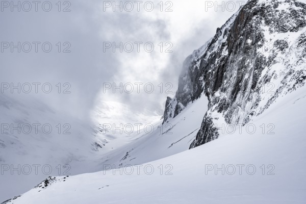 Snow-covered mountain landscape, ascent to the Wildhorn, cloudy mood, high tour, Bernese Alps,