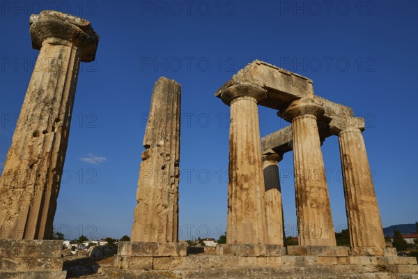Archaic Temple of Apollo, Doric columns, Ancient ruins with rows of columns under a clear blue sky,