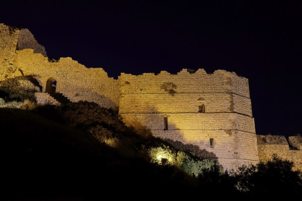 Night shot, A historic castle at night, illuminated and dramatically highlighted against the dark
