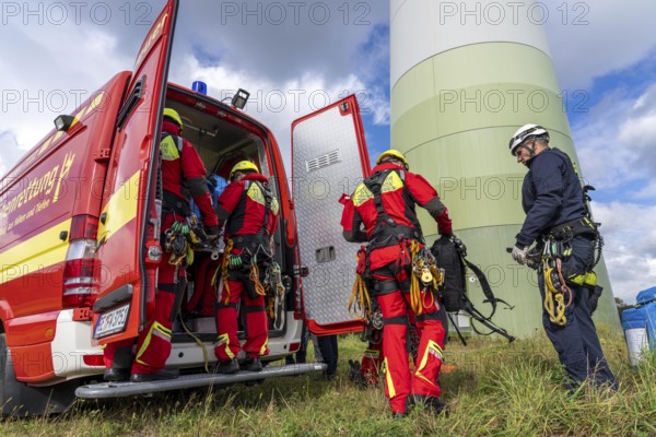 Height rescuers from the Gelsenkirchen fire brigade practise abseiling from a wind turbine from a