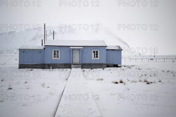 Blue house, winter landscape, research settlement, Ny-Ålesund, Spitsbergen Island, Svalbard and Jan