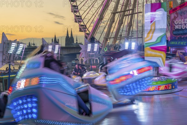 Deutz funfair on the Rhine, at Easter, funfair, break-dancer ride, Ferris wheel, Cologne Cathedral,
