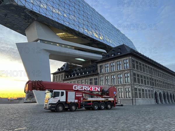 Building cleaners cleaning window panes, cleaning a facade, lorry working platform of the German