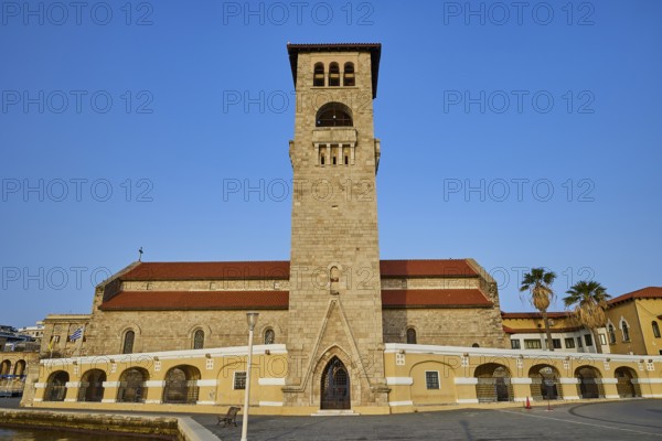 A church with bell tower and arcades under a blue sky, Church of the Annunciation of the Blessed