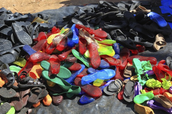 South Ethiopia, market in Jinka, market day, trade with plastic sandals, plastic shoes, market