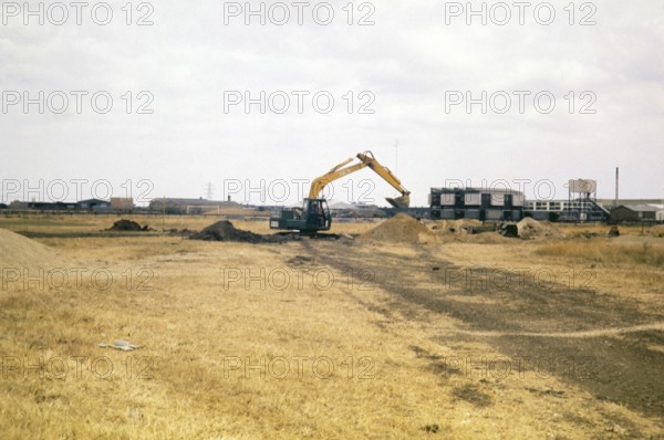 Mechanical excavation machinery, Cambridge University archaeological site called Great Shelford,