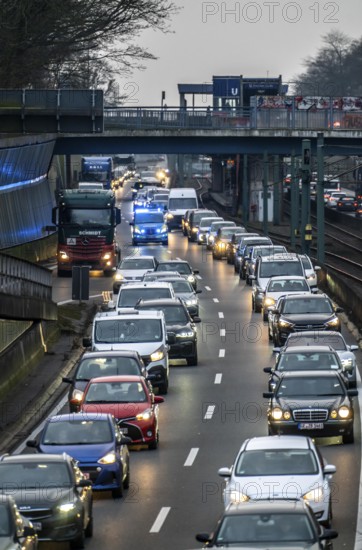 Traffic jam on the A40 motorway, emergency lane, vehicles on the left and right, police patrol car