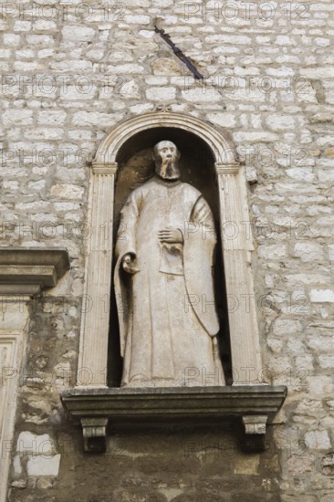 Religious statue in recess on outside wall of City Museum, Sibenik, Croatia, Europe