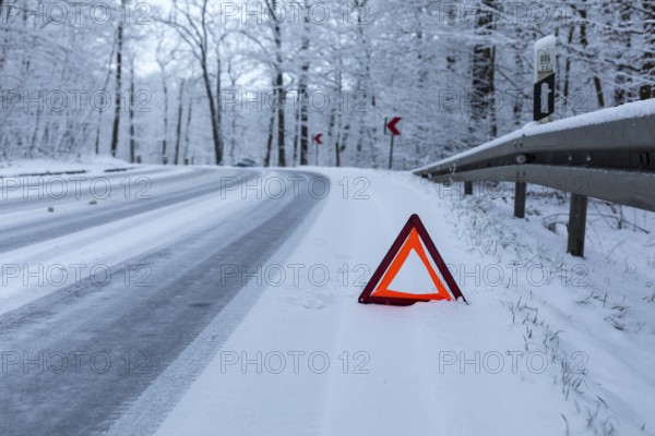 Car left the road in a bend due to snow and ice, Spitzgrund Coswig, Saxony, Germany, Europe