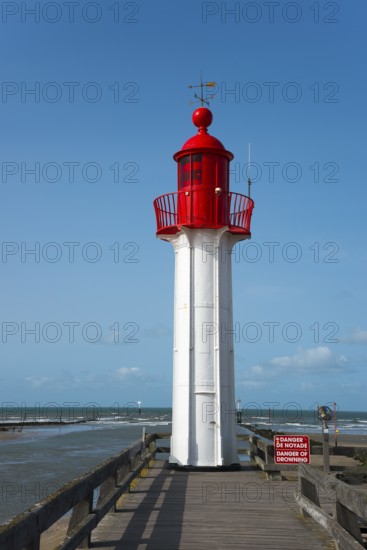 Close-up of a red lighthouse with blue sky and sea, Trouville-sur-Mer, Trouville, river Touques,