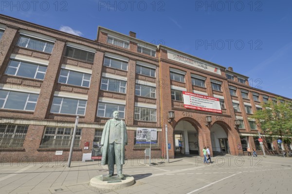 Adam Opel memorial, bronze statue in front of the old Opel main portal, Bahnhofsplatz, Rüsselsheim,