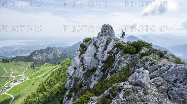 Climber on a climbing tour, climber on a mountain ridge, alpine climbing, crossing the Kampenwand,