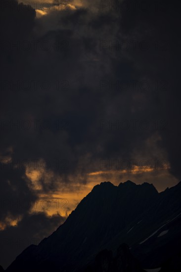 Summit in the morning light with dramatic clouds, Lech, Lechquellengebirge, Vorarlberg, Austria,