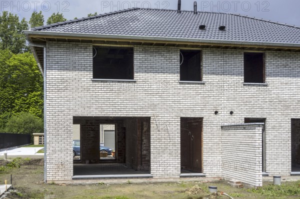 Construction phase of newly built house, new development semi-detached house