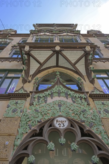 Oriel with decorations on historic commercial building, view upwards, detail, inscription, house