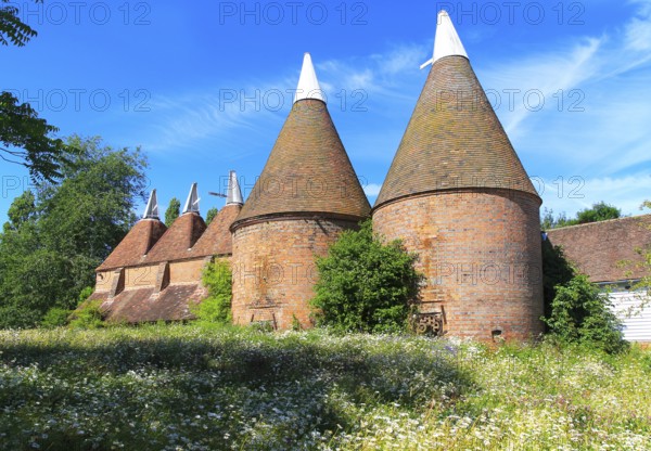 Historic oast house buildings at Sissinghurst castle gardens, Kent, England, UK