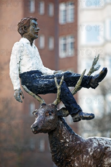 Sculpture by Stephan Balkenhol entitled Man with stag, painted bronze, surreal combination,