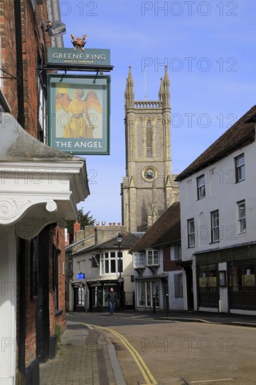Church tower historic buildings Angel pub sign, town centre Andover, Hampshire, England, UK