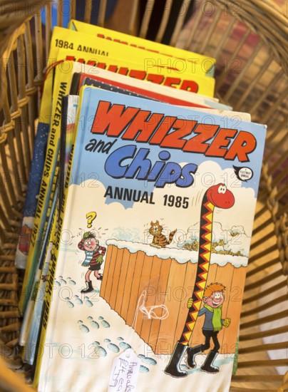 1980s children's cartoon comic book annuals Whizzer and Chips 1985, inside antiques centre,
