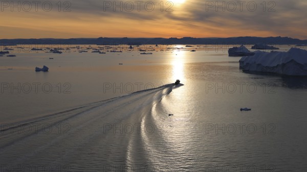 Iceberg seen from cruise ship vacation near Greenland coast in Arctic circle near Ilulissat Disko