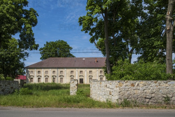 Ruined manor house or Schönfeld Castle, a heritage-protected classicist building from 1783, in
