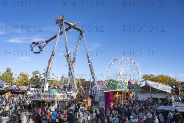 Crowd of people on fairground, amusement park, amusement ride, Ferris wheel, showmen, on the