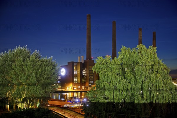 Wolfsburg NordSüd cogeneration plant in the evening with Mittellandkanal, Volkswagen AG main plant,