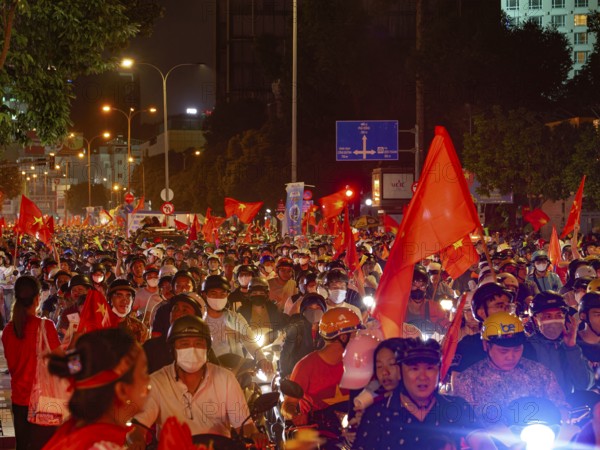 Football fans celebrate in the streets, victory in Asean championship against Thailand, many