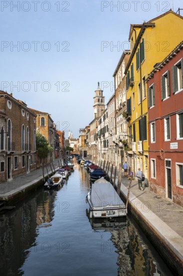 Motorboats and colourful house facades on a small canal, Venice, Veneto, Italy, Europe