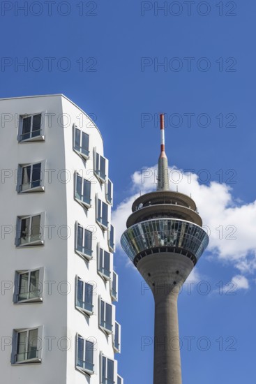 Gehry buildings and Rhine Tower, Media Harbour, Neuer Zollhof, Düsseldorf, North Rhine-Westphalia,