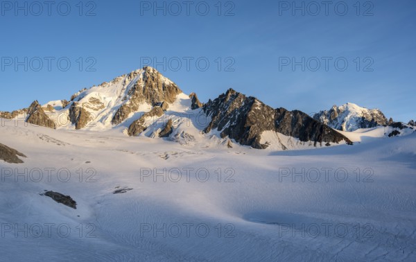 High alpine mountain landscape at sunset, summit of Aiguille de Chardonnet and Aiguille Verte,