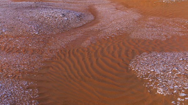Gravel surrounded by wind-blown sand structures, Huqf stone desert, Arabian Peninsula, Sultanate of