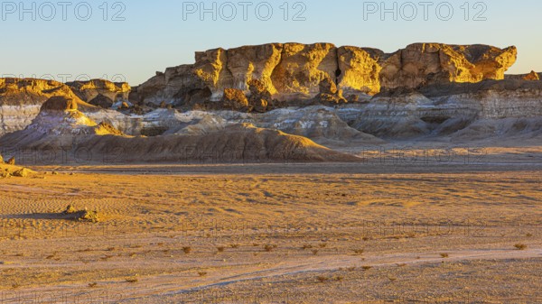 Eroded rock formations on a fossilised reef edge, at blue hour, Huqf stone desert, Arabian