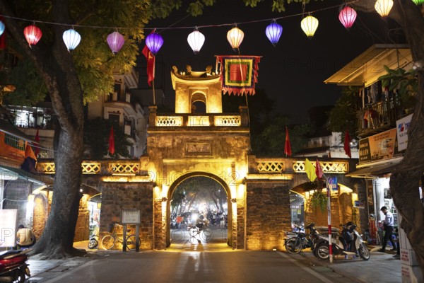 Illuminated old city gate at night, Hanoi, Vietnam, Asia