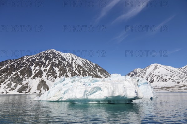 Iceberg melting in summer in Magdalenefjorden, fjord in Albert I Land on Svalbard, Spitsbergen,