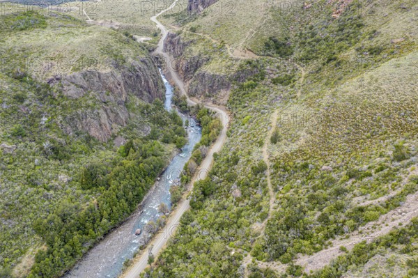 Canyon of river Rio Claro west of Puerto Ingeniero Ibanez, gravel road along the river, aerial