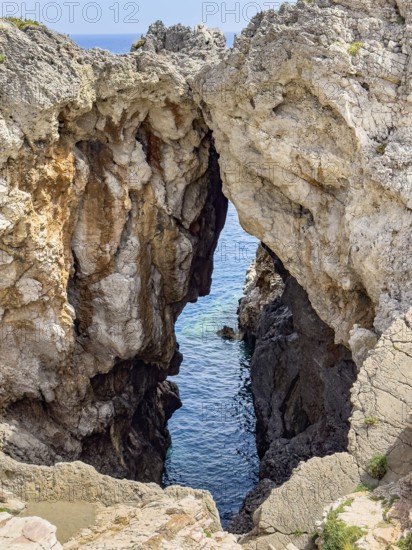 View of striking rock with narrow crevice at the exit of Avios Pavlos Bay, Agios Pavlos, Crete,