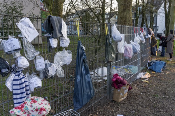 Gift fence with donations for the homeless and needy, food, hygiene articles, clothing, in Essen