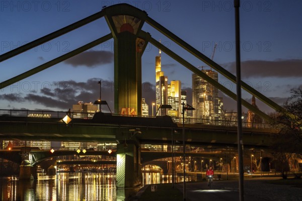 Skyline of the city centre of Frankfurt am Main, raft bridge over the river Main, dusk, Hesse,